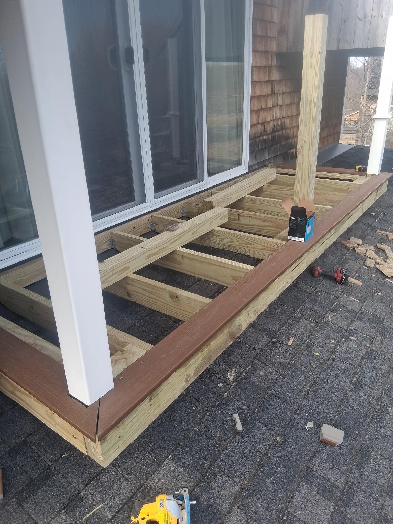 Composite decking boards being installed