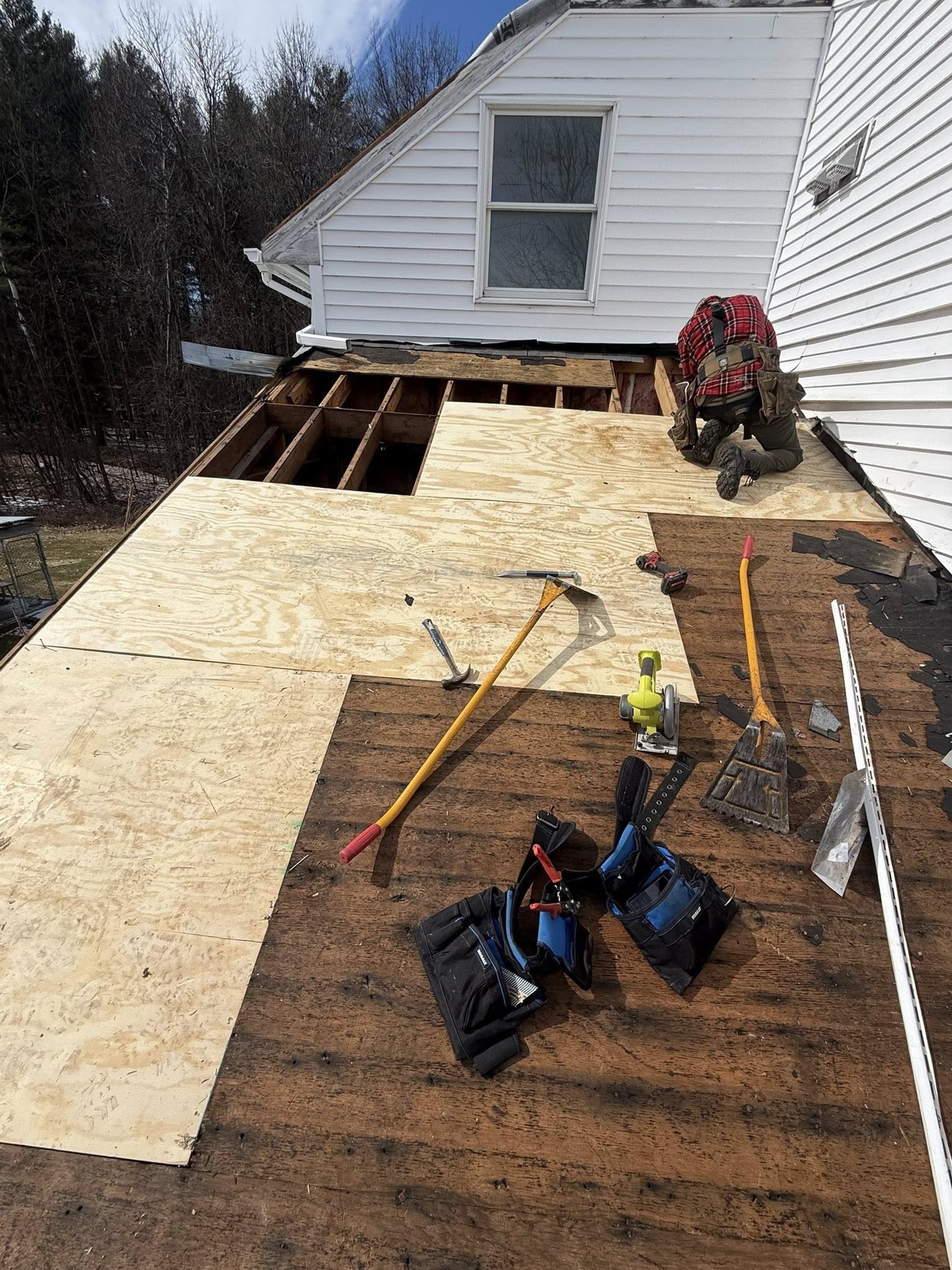 New sheathing boards being installed